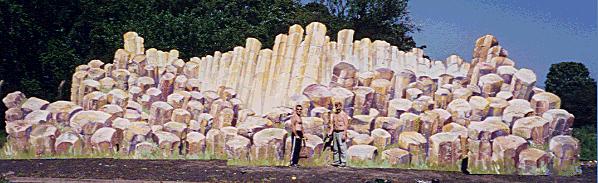 Two carpenters stand beside 58 ft long painting of Giant's Causeway