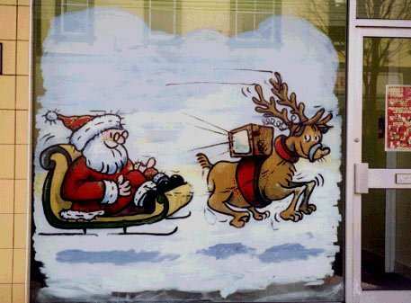 Painting on window of Santa watching TV strapped to reindeer's back