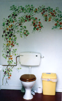 Nasturtiums painted on toilet wall